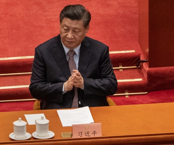 Chinese President Xi Jinping applauding