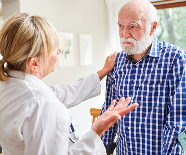 a doctor and an elderly patient