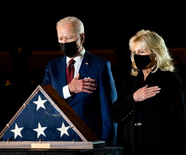 the bidens wear black face masks and put their hands on their hearts to pay respects to brian sicknick