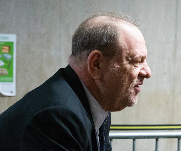 harvey weinstein using a walker, facing right