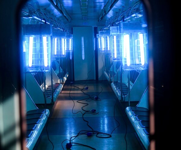 the inside of a train car is blasted with uv light.
