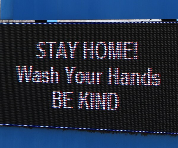 a digital message board urging people to stay home
