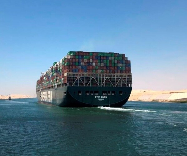 The container ship Ever Given sailing across the ocean 