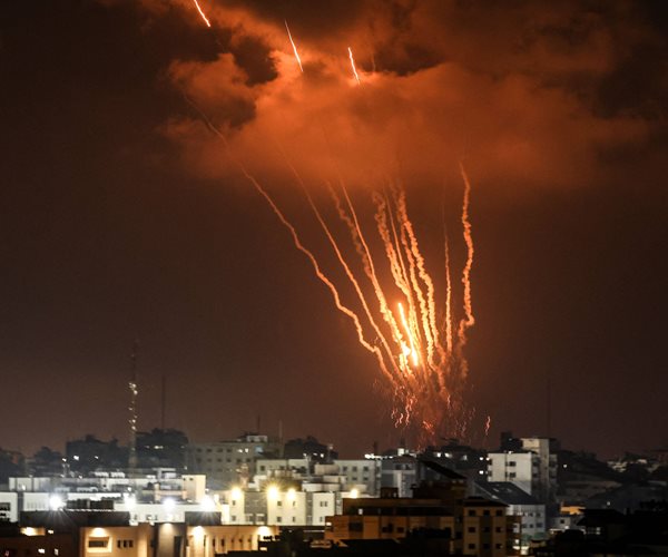 Rockets light up the night sky over Gaza City.