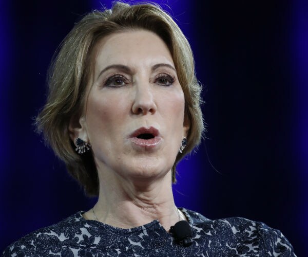 Carly Fiorina is shown in a blue dress