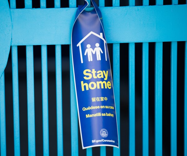 a sign in San Francisco urging people to stay home