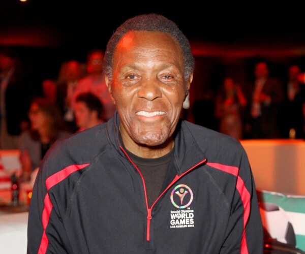 johnson in a black tracksuit with red stripes