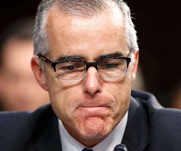 andrew mccabe looks down dejectedly during congressional testimony