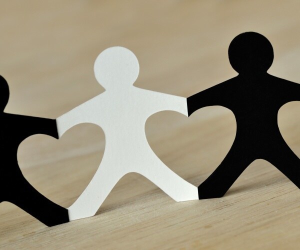 black and white people chain made of paper with anti-racism concept