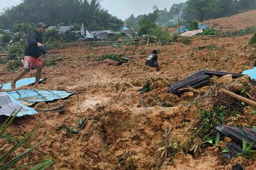 Rescuers Search for Dozens Buried in Indonesian Landslides