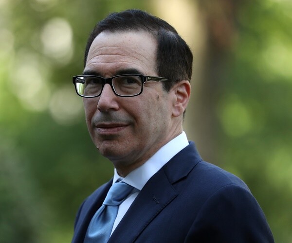 steven mnuchin walks across the white house lawn