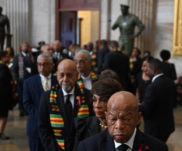 congressional black caucus members gather in a line for elijah cummings memorial