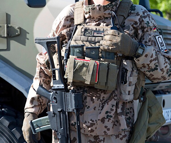 an american soldier in afghanistan in full camo gear