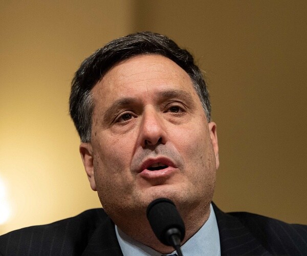 ron klain talks into microphone