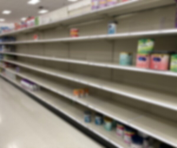 grocery store shelves mostly empty of baby formula