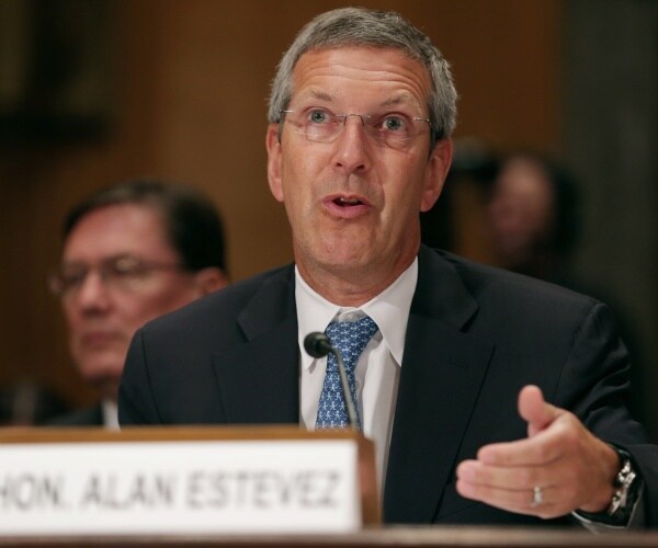 alan estevez speaks into a microphone