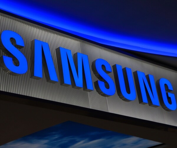 samsung logo is shown lit up in blue with gray background
