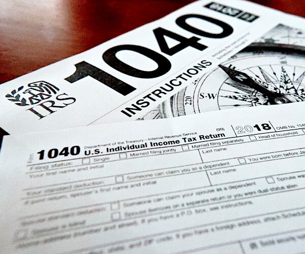 1040 tax return documents lay on the table