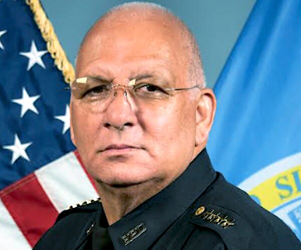 dennis white in a police uniform before he was officially fired as commissioner by the acting mayor