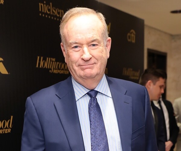 bill o'reilly pauses for a photo at an event