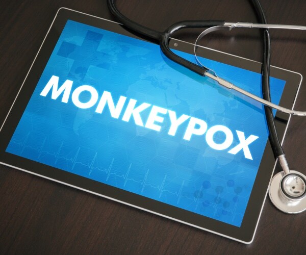 tablet with "monkeypox" on screen and a stethoscope