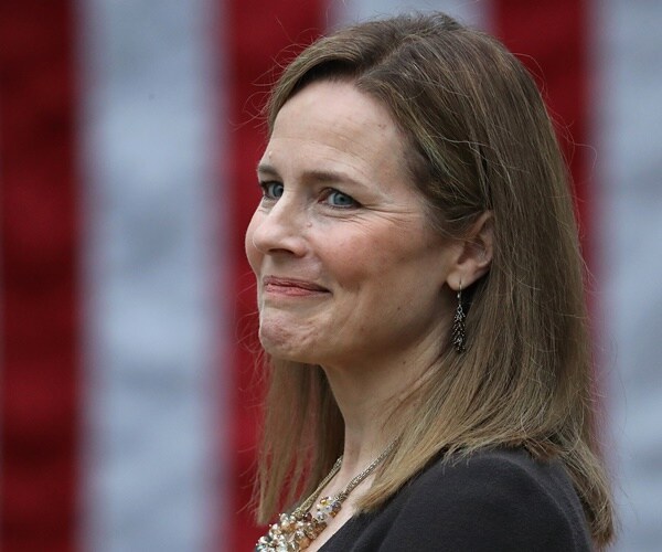amy coney barrett smiles during her nomination annoucement