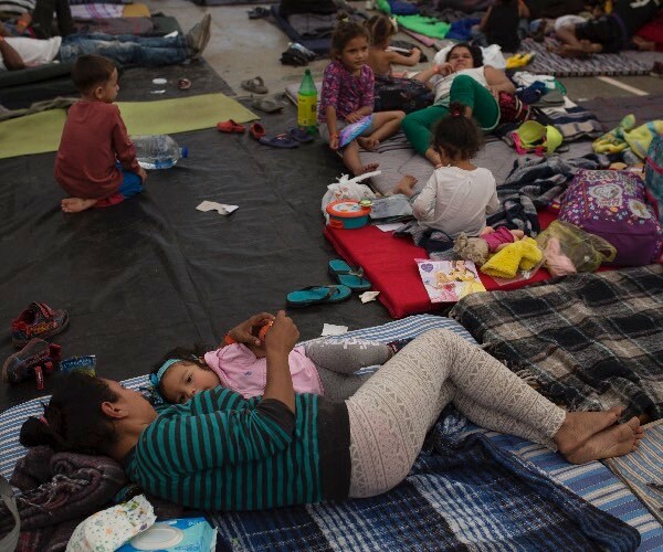 honduran migrant glenia cruz feeds her daughter aisley, at a shelter in tijuana, mexico.