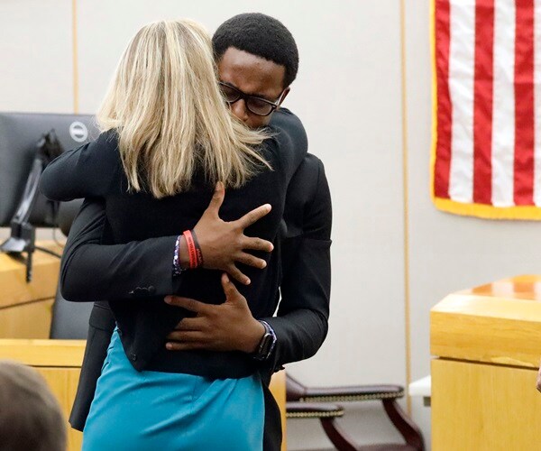 Judge, Victim's Brother Hug Ex-Dallas Cop Convicted of Murder