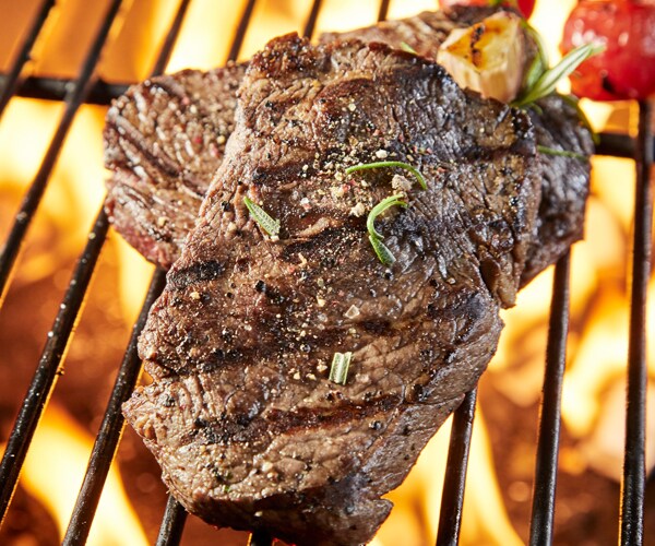 steak cooking on a grill