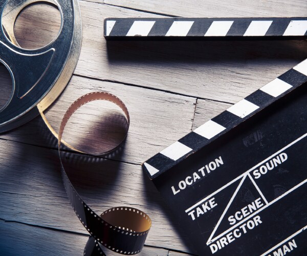 a movie reel and a clapboard