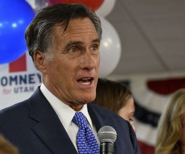 mitt romney speaks to an election night party after his victory. 