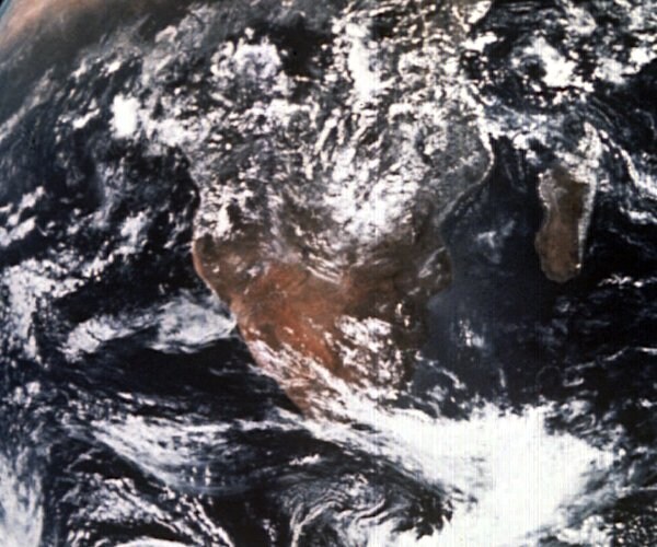 a view of a cloud-covered continent of africa from outer space.