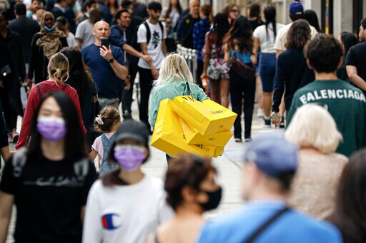 AP PHOTOS: Sunshine, Espressos, Shopping as Europe Opens up
