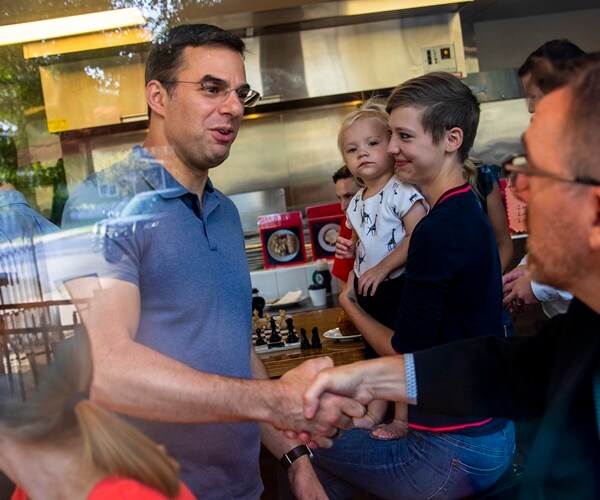 justin amash shakes hands with supporters