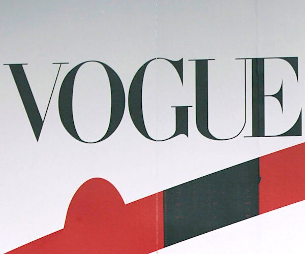 vogue magazine signage is one a red carpet backdrop