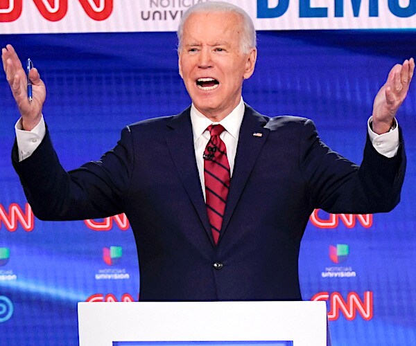 joe biden gestures during a democratic presidential primary debate