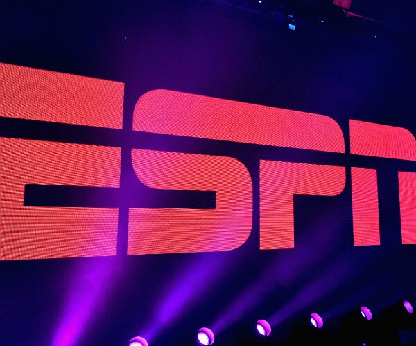 espn logo is seen on a purple background