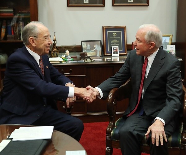 senator chuck grassley shakes attorney general jeff sessions' hand