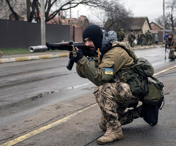 Ukrainians Curse Russian Invaders as Dead Civilians Found in Liberated Towns
