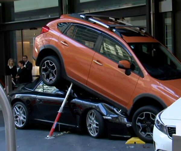 Valet Rams Porsche 911 Carrera Under Subaru at Australia Hotel