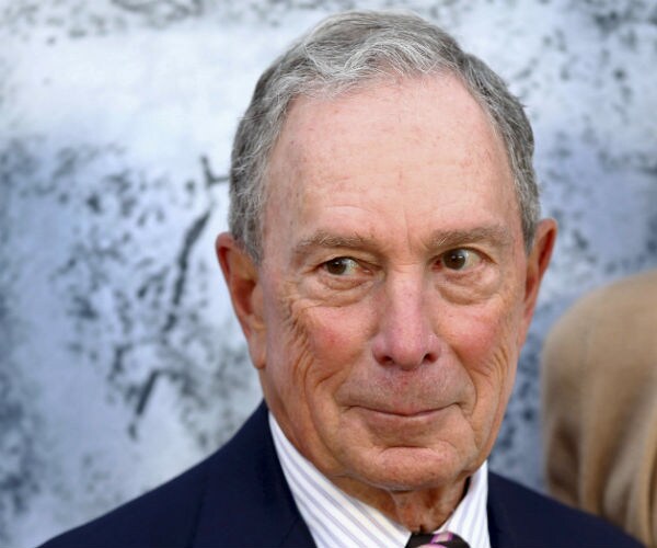 michael bloomberg is shown in blue suit jacket, tie and striped shirt