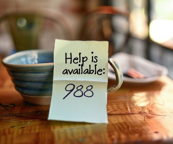 post-it note with 988 written on it