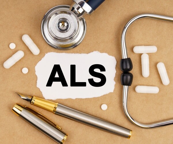 ALS written on paper, some drugs around it and a stethoscope
