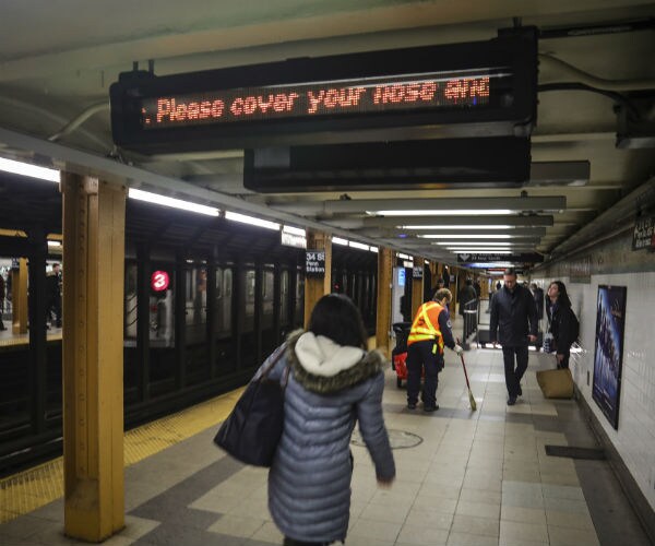 a subway information ticker cautions riders on how to take preventive measures as concerns grow around COVID-19. 