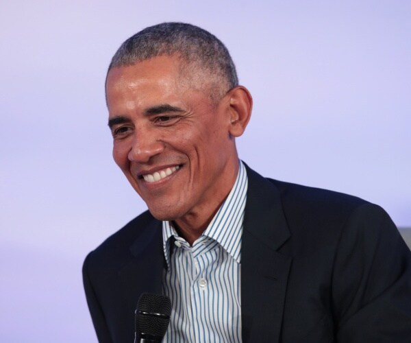 former president barack obama speaks to guests at the obama foundation summit