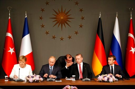 The Latest: Syria Summit: Leaders Call for UN-backed Process