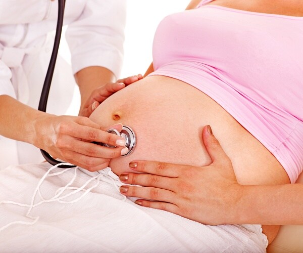 pregnant woman with doctor