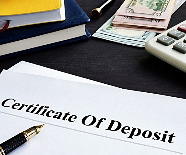 certificate of deposit and pen in an office