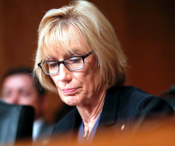 maggie hassan looks down in shame during a senate judiciary hearing