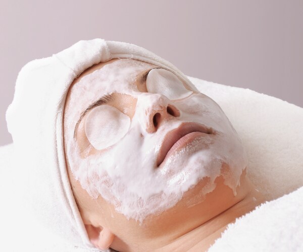 a woman getting a facial